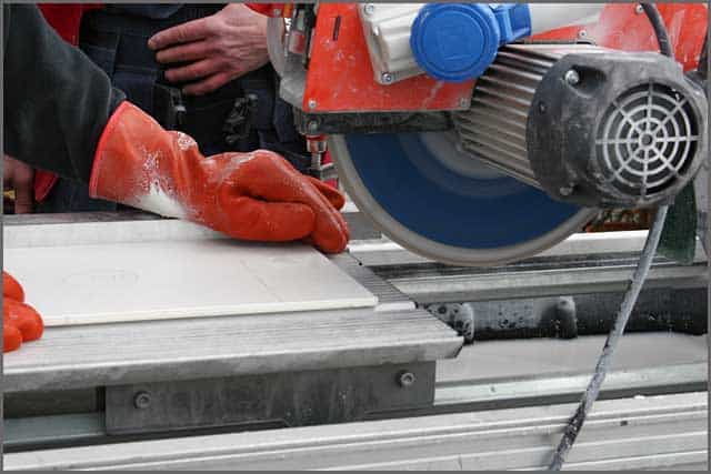 Tile Saw Blade - two workers using a tilesaw to saw tiles