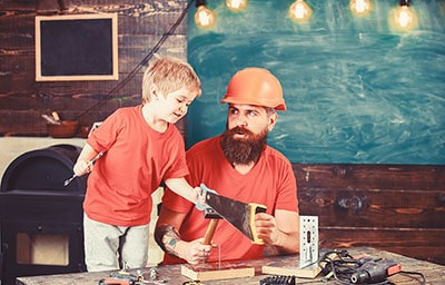 playing with toy saw, learning use tools with dad