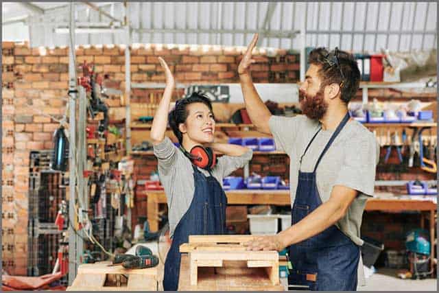 Thumbs up picture of satisfied workers