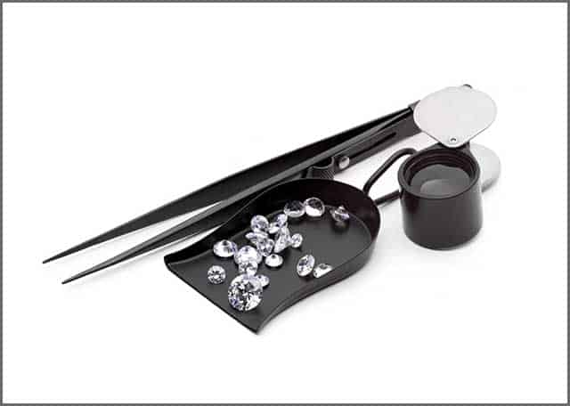 Various kinds of jeweler tools and some pieces of the diamond