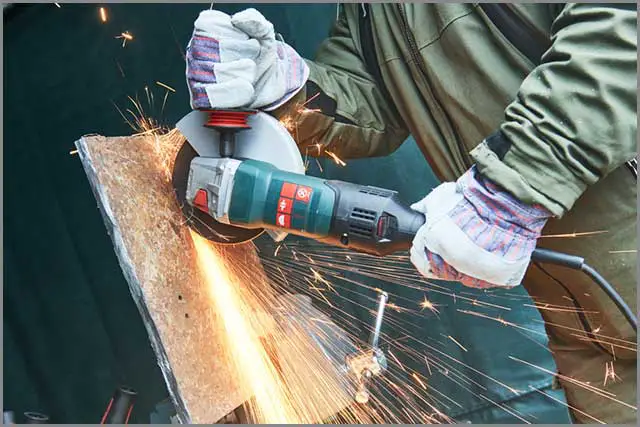 Diamond Blade: A worker cutting through a metal sheet with an angle grinder