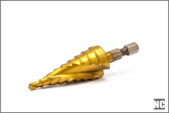 Step and cone drill bits