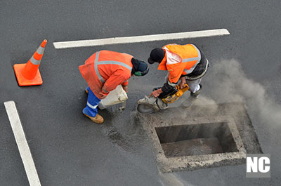 People working with road diamond saws