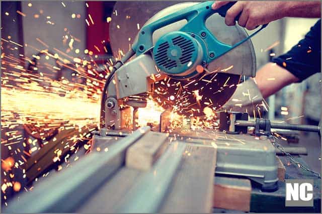 (Industrial engineer engaged in cutting metal and steel with sharp TCT saw blades)