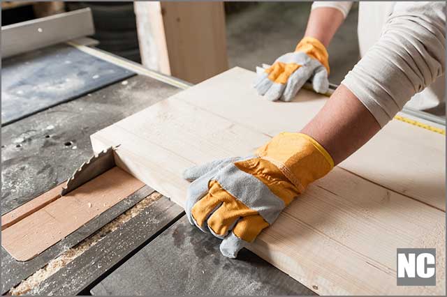 Worker wearing protective gloves