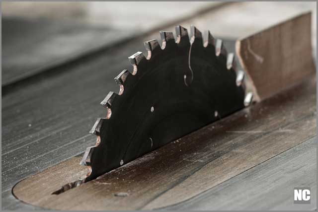 A newly replaced table saw a cross-cuts blade.