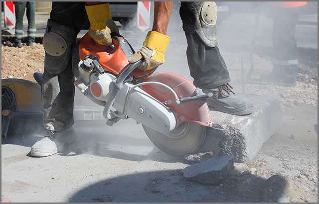 A worker using a power tool