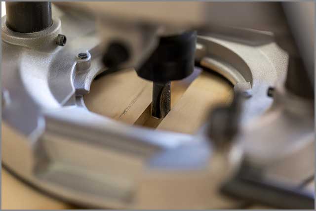 Plunge Router Shaping a Groove.