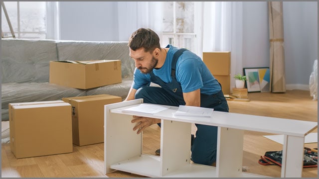 A professional assembling cabinets