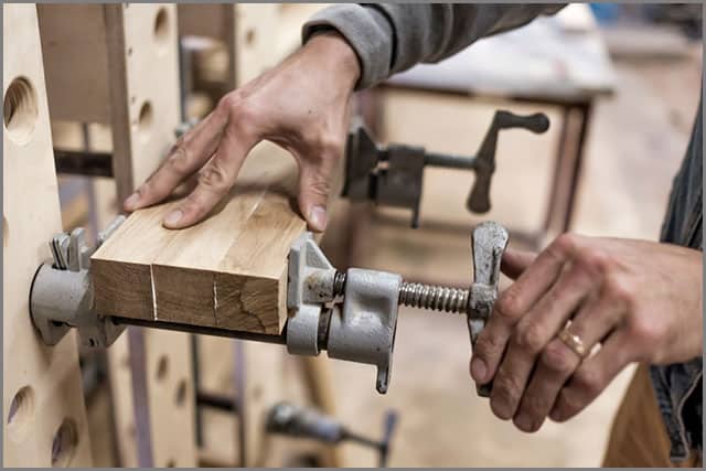 Using clamps to connect wooden timbers