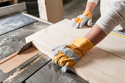 A carpenter cutting wood