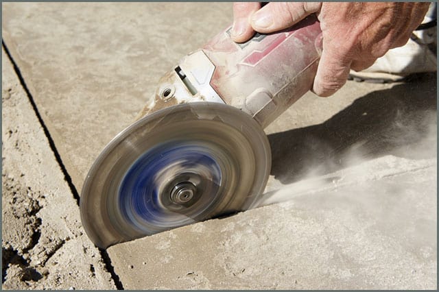 Angle grinder scoring concrete