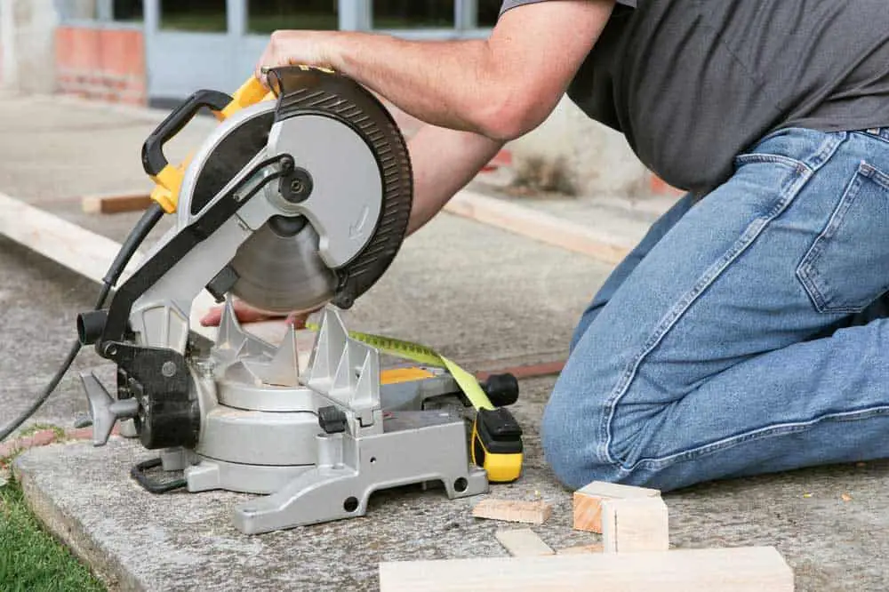 Man Using a Miter Saw