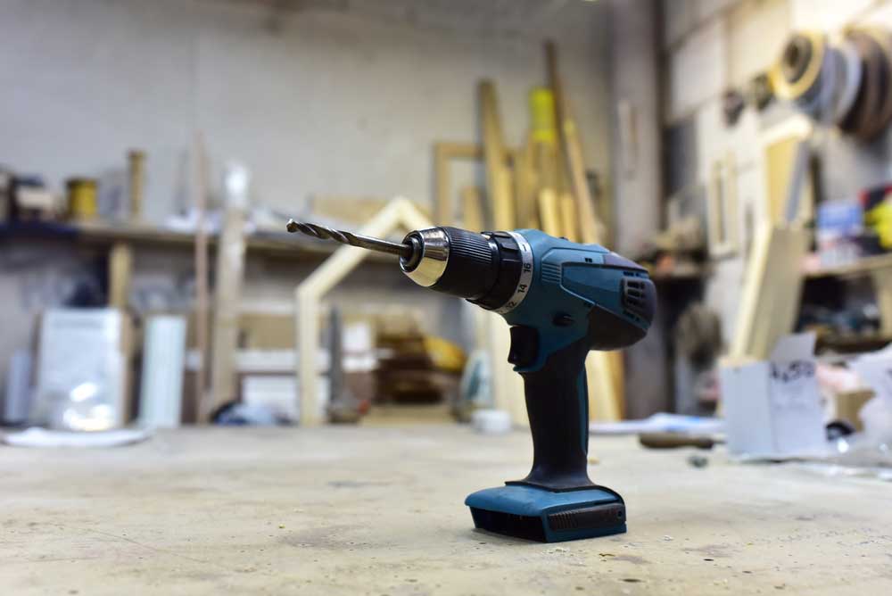 Cordless impact driver in a workshop.