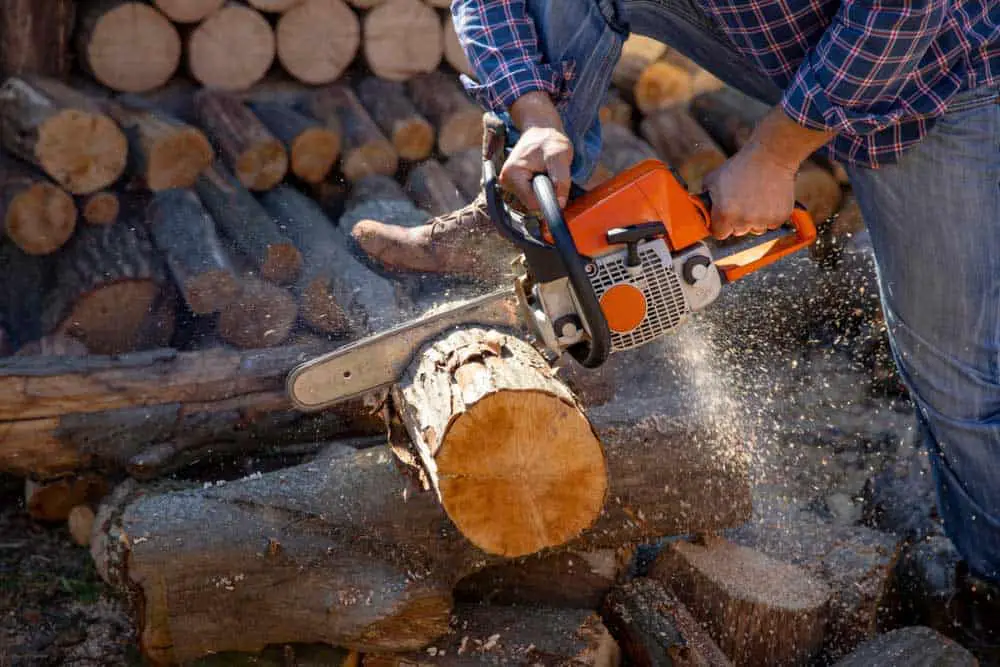 Semi-chisel chain being used to cut firewood