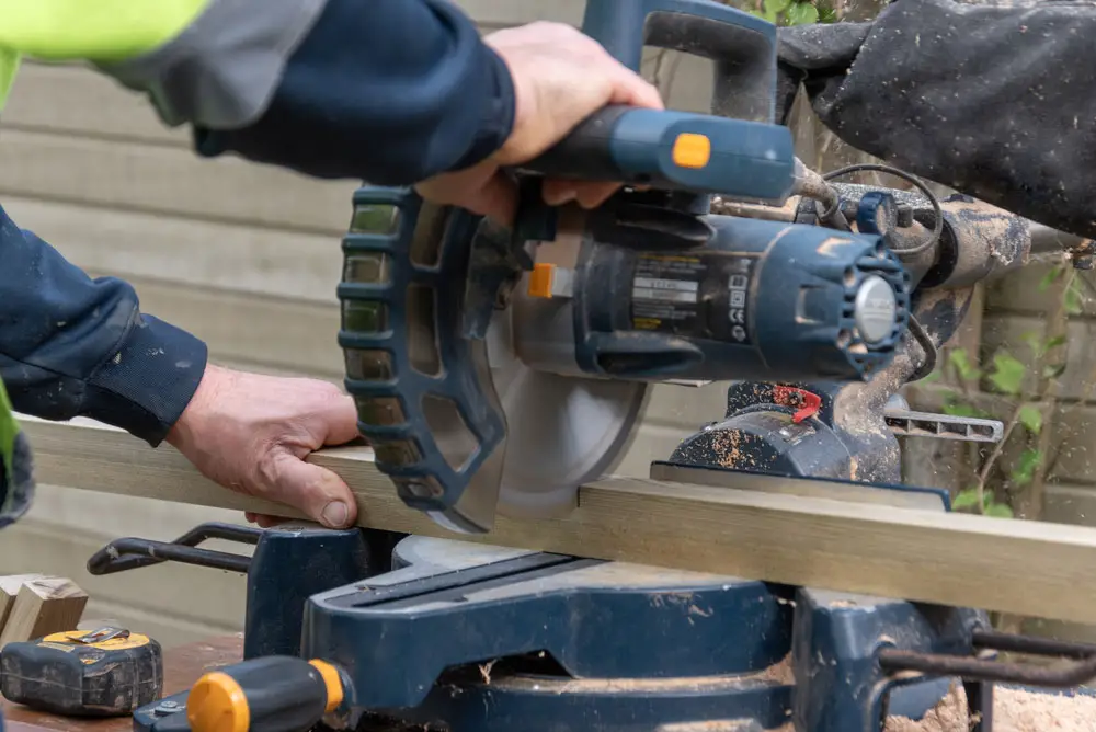 carpenter using a cordless circular saw